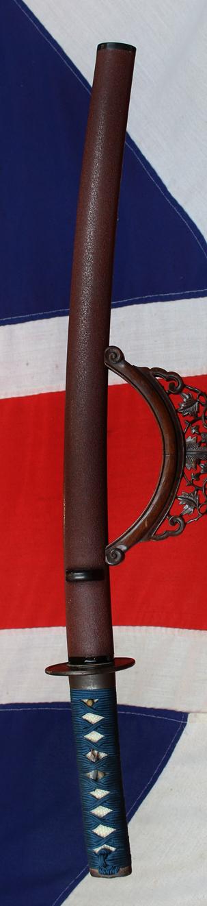 A Good Yoshii School Wakazashi, Likely Muromachi, Signed Yoshii Mitsunori Dressed With A Stunning Livery of Brown Ishime Lacquer Complimented With a Finest Blue Silk Tsukaito Hilt Wrap