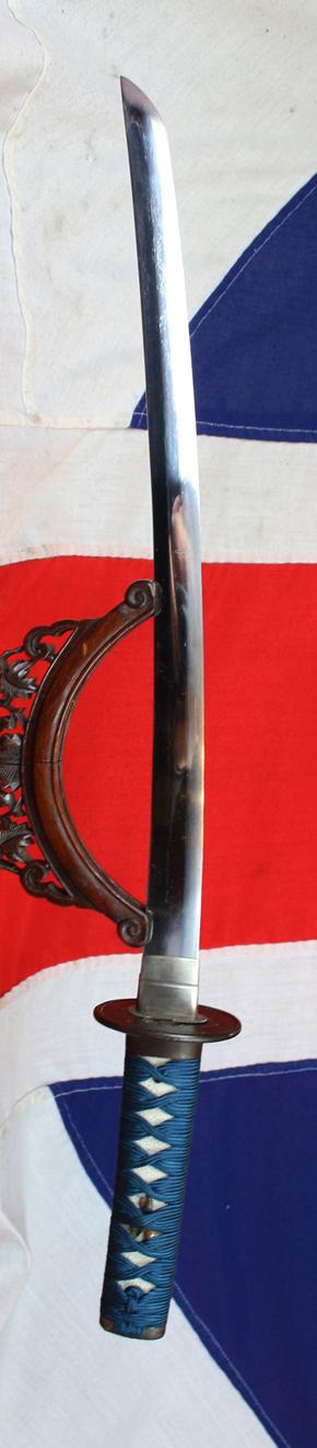 A Good Yoshii School Wakazashi, Likely Muromachi, Signed Yoshii Mitsunori Dressed With A Stunning Livery of Brown Ishime Lacquer Complimented With a Finest Blue Silk Tsukaito Hilt Wrap