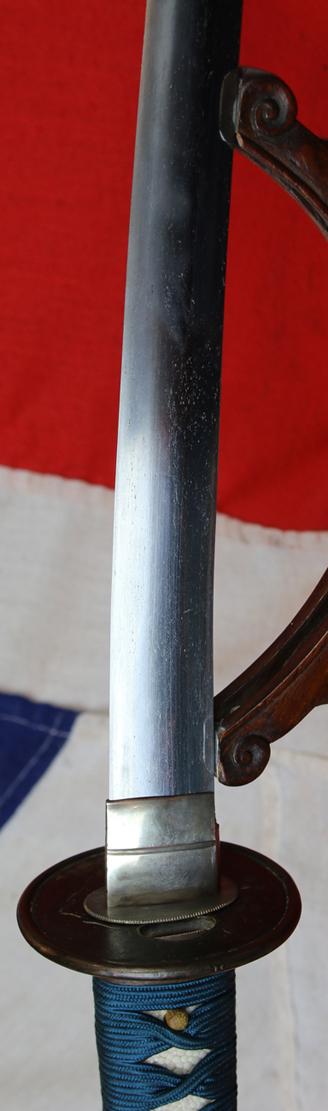 A Good Yoshii School Wakazashi, Likely Muromachi, Signed Yoshii Mitsunori Dressed With A Stunning Livery of Brown Ishime Lacquer Complimented With a Finest Blue Silk Tsukaito Hilt Wrap