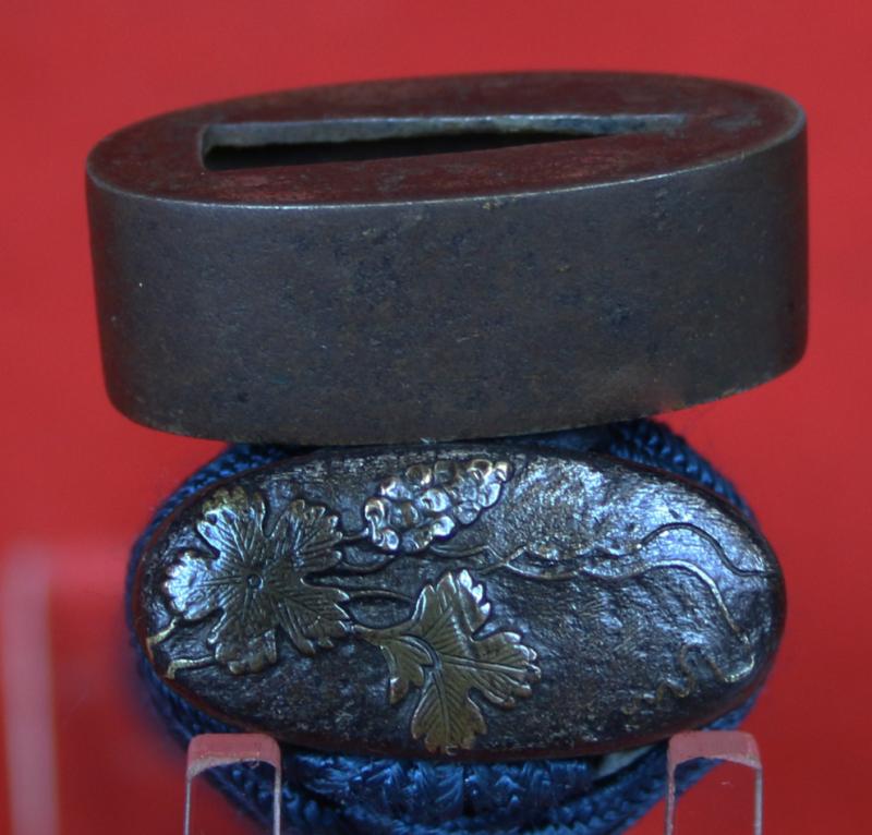 A Good Yoshii School Wakazashi, Likely Muromachi, Signed Yoshii Mitsunori Dressed With A Stunning Livery of Brown Ishime Lacquer Complimented With a Finest Blue Silk Tsukaito Hilt Wrap