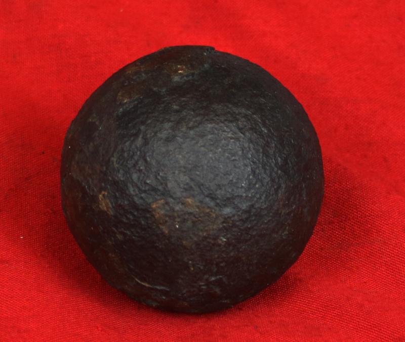 A Superb Original Waterloo Recovered Souvenir '6 Pounder ' Royal Artillery Cannon Ball Fired at La Haye Sainte During The Battle, Recovered From The Farm. With Clear Impact Site To The Ball.