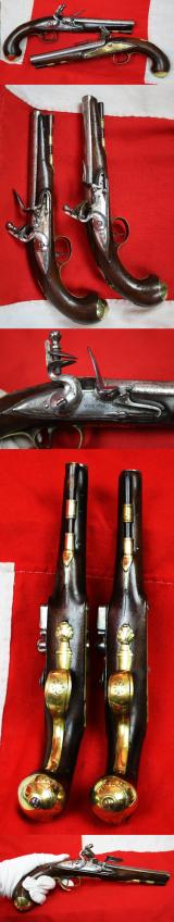 A Very Fine Pair of 1770's Gentleman' or Officers Holster Pistols. Fine Juglans Regia Walnut Stocks, All Brass Cast Furniture Mounts Beautifully Engraved. Bright Steel Barrels & Flintlocks Signed Waters & Ward