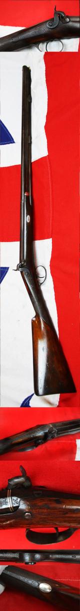A Most Fine 1840 Bespoke English Fowling Piece, with Finest Elaborate Engraving, Juglans Regia Walnut Stock and and Damascus Twist Barrel. Finely Engraved Throughout with Hunting Dogs, Scrollwork and Gamebirds