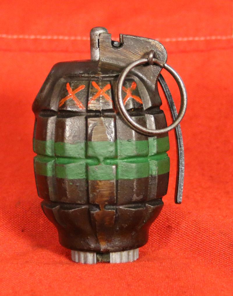 An Excellent British Army WW2 Mills Bomb Grenade In Superb Condition With Fine Paint Green Stripe For Baratol or TNT and XXX Originally Meaning Primed and Ready. Made by ICI, Siebe Gorman & Thomas Adshead & Sons. Naturally it Is Empty and Safe now.
