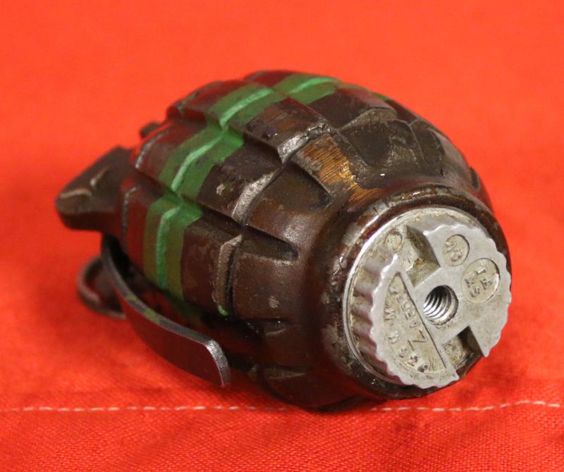 An Excellent British Army WW2 Mills Bomb Grenade In Superb Condition With Fine Paint Green Stripe For Baratol or TNT and XXX Originally Meaning Primed and Ready. Made by ICI, Siebe Gorman & Thomas Adshead & Sons. Naturally it Is Empty and Safe now.