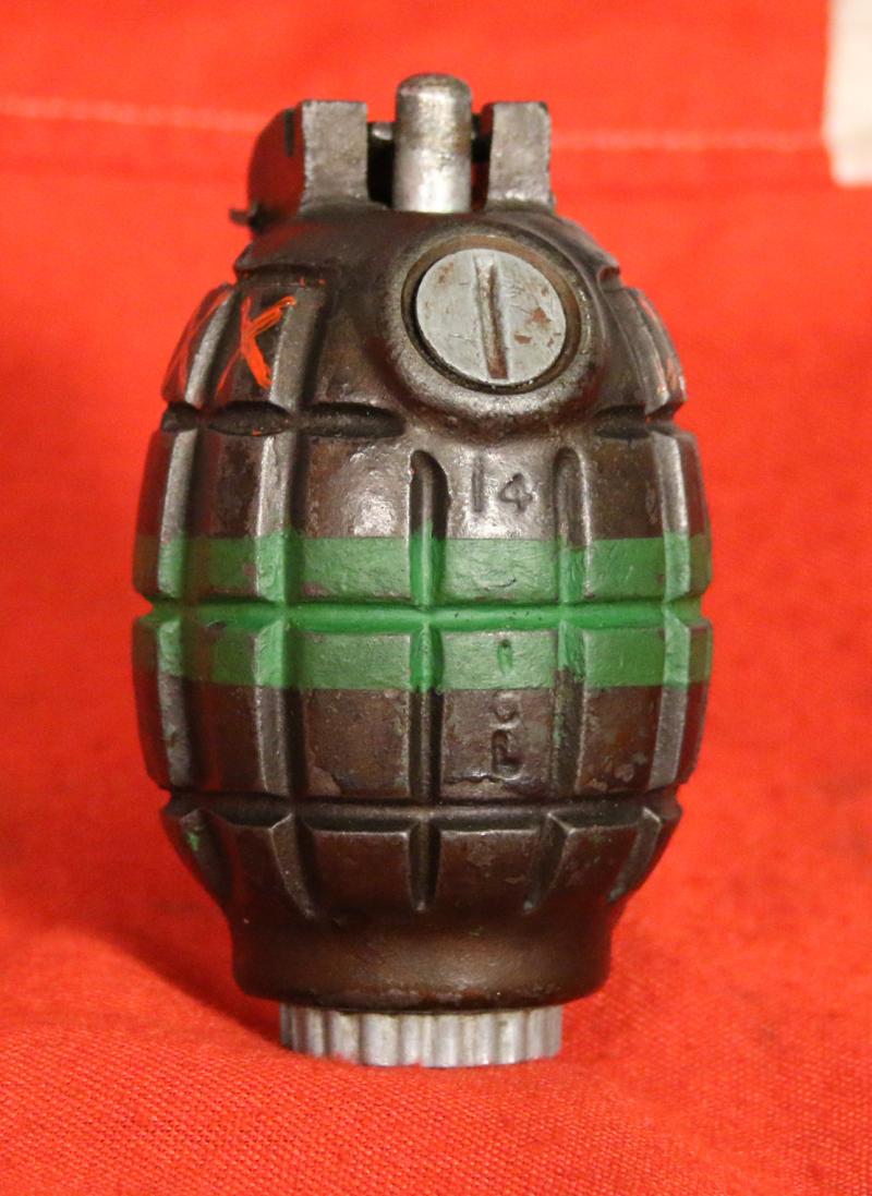 An Excellent British Army WW2 Mills Bomb Grenade In Superb Condition With Fine Paint Green Stripe For Baratol or TNT and XXX Originally Meaning Primed and Ready. Made by ICI, Siebe Gorman & Thomas Adshead & Sons. Naturally it Is Empty and Safe now.